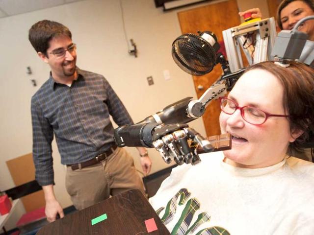 A-file-photo-of-a-52-year-old-woman-paralysed-from-the-neck-down-demonstrating-the-use-of-a-new-mind-controlled-prosthetic-arm-with-intuitive-control-to-help-her-eat-a-chocolate-bar-at-the-University-of-Pittsburgh-Medical-Centre-in-Pittsburgh-Reuters-University-of-Pittsburgh-Medical-Centre A-file-photo-of-a-52-year-old-woman-paralysed-from-the-neck-down-demonstrating-the-use-of-a-new-mind-controlled-prosthetic-arm-with-intuitive-control-to-help-her-eat-a-chocolate-bar-at-the-University-of-Pittsburgh-Medical-Centre-in-Pittsburgh-Reuters-University-of-Pittsburgh-Medical-Centre