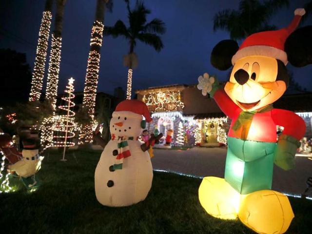 Christmas lights and decorations are displayed outside the house of Aleli Estacio, who said she has been putting up the display for 40 years, in Pasadena, California. Reuters