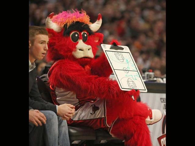 Benny the Bull, the mascot for the Chicago Bulls, holds a play chart with a Christmas tree drawn on it during a game against the Boston Celtics at the United Center in Chicago, Illinois. AFP photo