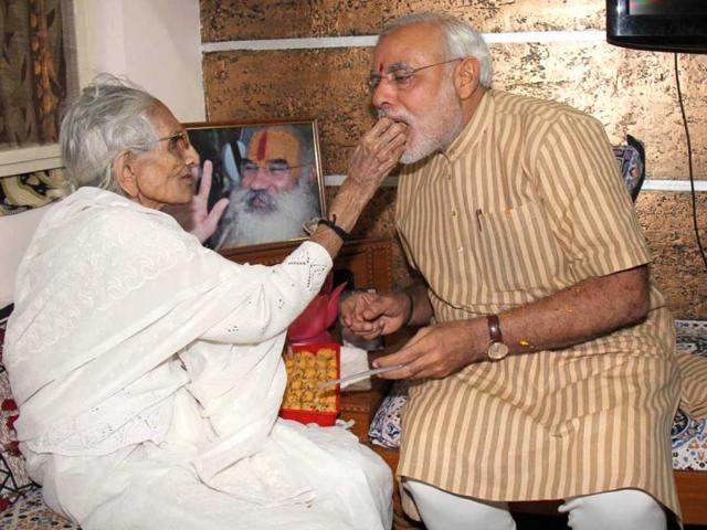 Gujarat-chief-minister-Narendra-Modi-seeks-blessings-from-his-mother-after-his-victory-in-Gujarat-Assembly-polls-UNI-Photo Gujarat-chief-minister-Narendra-Modi-seeks-blessings-from-his-mother-after-his-victory-in-Gujarat-Assembly-polls-UNI-Photo