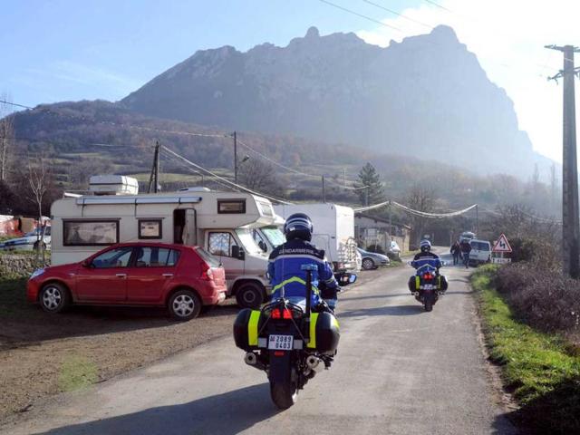 French Gendarmes patrol in a street where mobil-homes are parked in the French southwestern village of Bugarach, near the 1,231 meter high peak of Bugarach. Some believe, it is one of the few places on Earth, which will be spared from the impending apocalypse on December 21, according to Mayan calender. (AFP Photo)