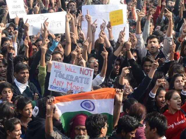 Demonstrators gesture with upraised middle fingers as they gather for a protest calling for better safety for women following the rape of a student last week, in front of the Government Secretariat and Presidential Palace in New Delhi. AFP photo
