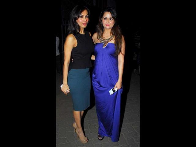 Malaika wore a sobre black top and blue pencil skirt while newly-turned-mommy Amrita Arora was seen in a peacock blue satin gown with an elaborate neckpiece on Christmas eve. Malaika wore a sobre black top and blue pencil skirt while newly-turned-mommy Amrita Arora was seen in a peacock blue satin gown with an elaborate neckpiece on Christmas eve.