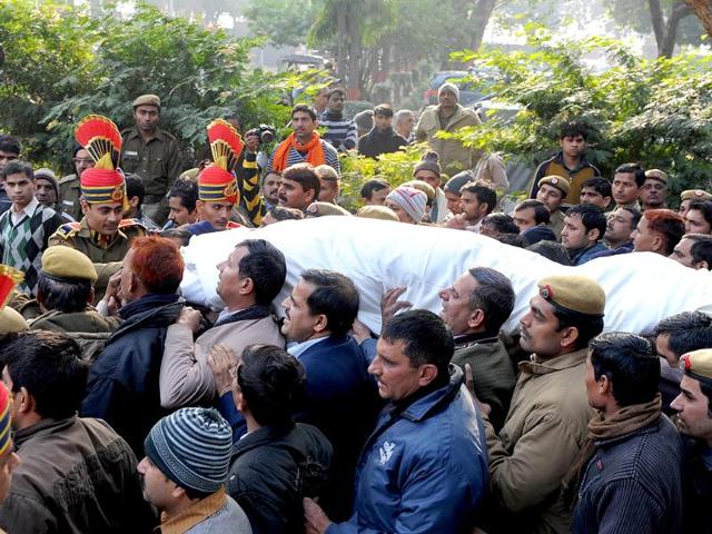 Mourners and relatives of fallen policeman Subash Tomar carry his mortal remains during his funeral in New Delhi. AFP/Sajjad Hussain