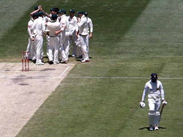 Sri Lanka's Angelo Mathews (R) walks off after being bowled by Australia's Mitchell Johnson for 35 runs during the third day of the second cricket Test at the Melbourne Cricket Ground. (Reuters)