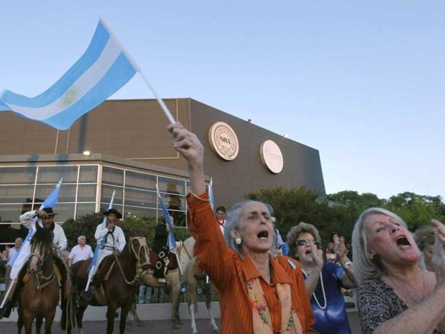 Women shout slogans against Argentine President Cristina Fernandez de Kirchner's decision to annul the sale of the Argentine Rural Society's show grounds to the Society in 1991, during a rally at the show grounds in Buenos Aires. (Reuters)