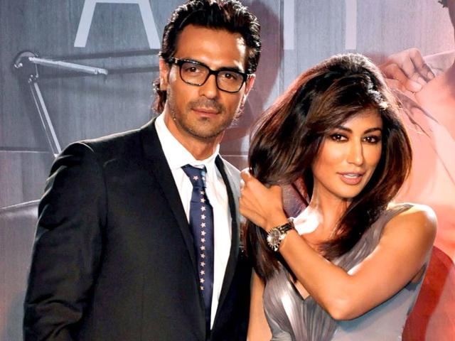While Arjun Rampal seems ready for the picture, Chitrangda's caught adjusting her hair for it.