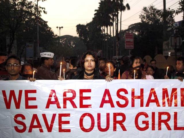 Women participate in a silent procession to mourn the death of a gang rape victim in Guwahati. AP Photo