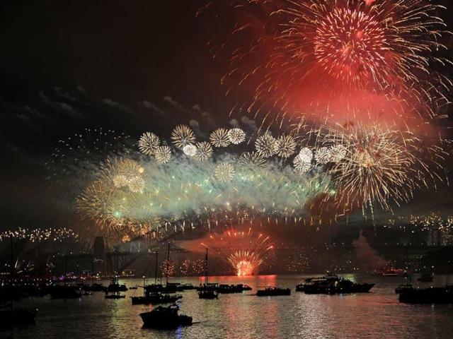 Spectator-boats-in-Sydney-Harbour-look-on-as-New-Year-s-Eve-fireworks-erupt-over-the-Sydney-Harbour-Bridge-on-January-1-2013-Photo-AFP-Greg-Wood Spectator-boats-in-Sydney-Harbour-look-on-as-New-Year-s-Eve-fireworks-erupt-over-the-Sydney-Harbour-Bridge-on-January-1-2013-Photo-AFP-Greg-Wood