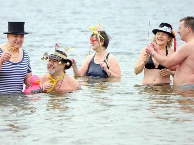 Winter bathers of the "Berlin Seals" attend a New Year's swimming event at the Orankesee lake on in Berlin. AFP Photo