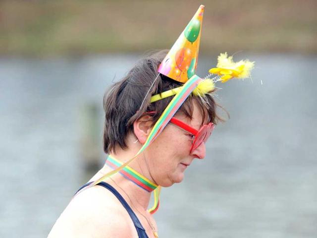 A winter bather of the "Berlin Seals" attends a New Year's swimming event at the Orankesee lake in Berlin. AFP Photo