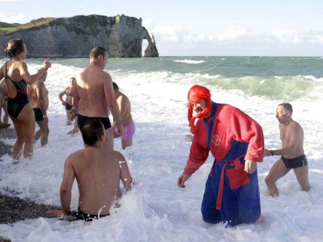 People participate in a traditional New Year's Day swim in front of the famous cliff at Etretat, western France. Reuters