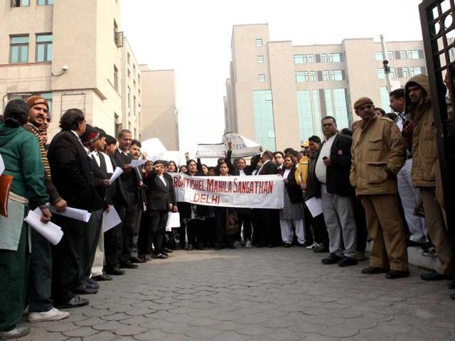 Pragatisheel Mahila Sangathan activists and lawyers shout slogans during a protest over the recent gangrape, at Saket District Court in New Delhi. The Delhi Police filed chargesheet against the five of the six accused in the brutal gangrape of the 23-yr-old girl in the fast track court setup in the Saket court. PTI/Kamal Singh