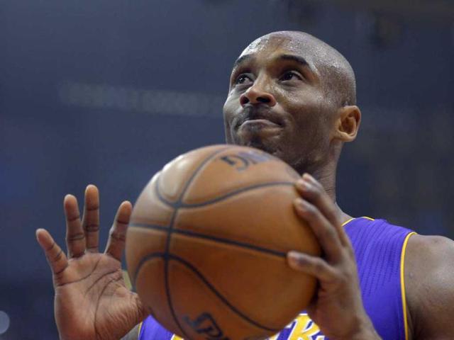 Los Angeles Lakers guard Kobe Bryant reacts during the first half of their NBA basketball game against the Los Angeles Clippers in Los Angeles. AP Photo