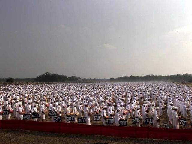 People wearing traditional Assamese attire play the khol, a traditional percussion instrument of Assam, in an attempt to create a Guinness record, in Titabar, about 350 kilometers east of Guwahati. A total of 14,833 people participated in the event, according to officials. AP/Anupam Nath
