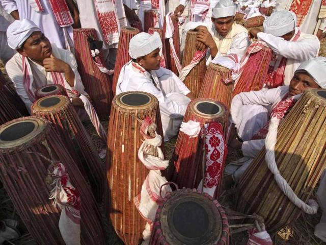 People in traditional attires play their drums during an attempt to enter the Guinness Book of World Record at a field in Titabar town in the northeastern Assam. Reuters/Utpal Baruah