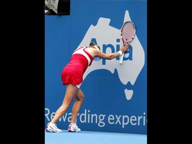 Russia's Nadia Petrova stretches after losing a point against Roberta Vinci of Italy during their women's singles first round match at the Sydney International tennis tournament in Sydney. (Reuters)