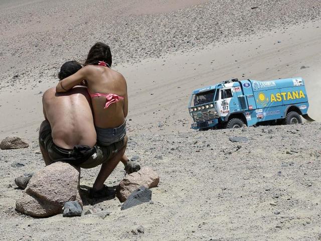 Spectators watch as co-pilots Kazakhstan's Artur Ardavichus, Alexey Nikizhev and Nurlan Turlubayev compete with their Kamaz truck during the 3rd stage of the Dakar Rally 2013 from Pisco to Nazca. Reuters photo
