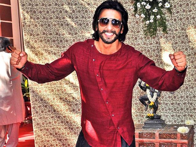What exactly are you trying to do?! Ranveer Singh poses for the cameras at Shaad Ali's wedding.