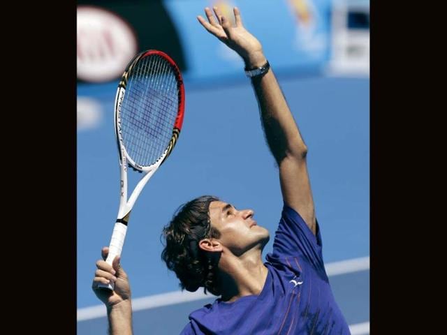 Switzerland's Roger Federer serves during a practice session at Melbourne Park as he prepares for next week's Australian Open tennis championship in Melbourne.(AP Photo)