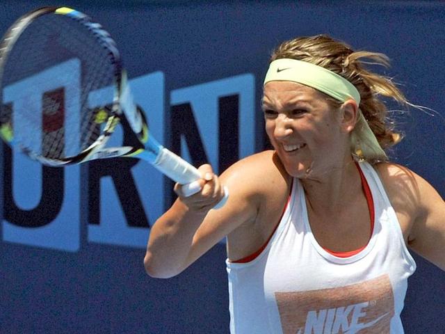 Defending champion Victoria Azarenka of Belarus takes part in a practice session for the upcoming Australian Open tennis tournament in Melbourne. (AFP Photo)