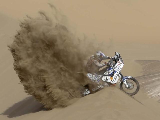 KTM rider Jorge Aguilar of Salvador tries to get out of a dune during the 6th stage of the 2013 Dakar Rally from Arica to Calama, Chile.(AP Photo)