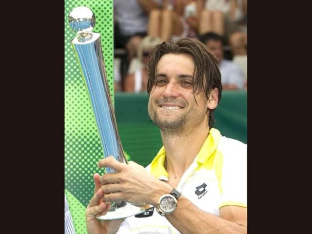 Spain's David Ferrer poses with the trophy after defeating Germany's Philipp Kohlschreiber in the singles final at the Heineken Open men's tennis tournament in Auckland, New Zealand. AP photo