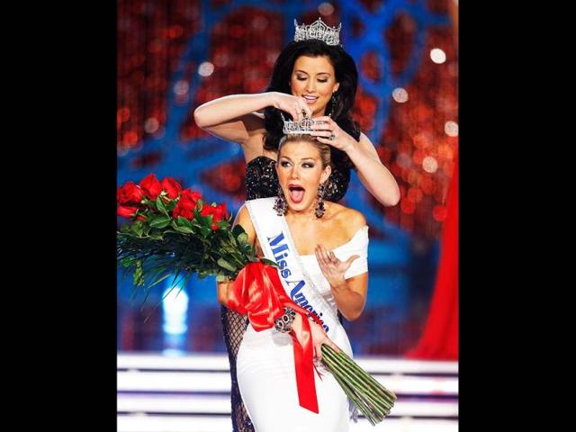 Miss New York Mallory Hagan is crowned Miss America 2013 by Miss America 2012 Laura Kaeppeler in Las Vegas. AP photo