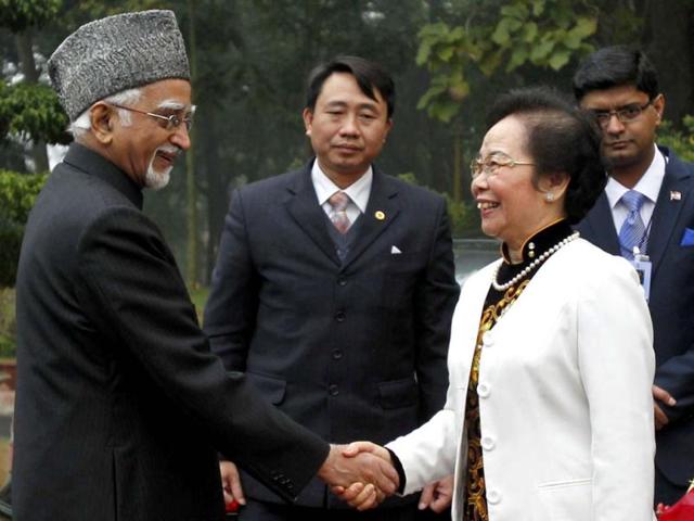 Vice president Mohammad Hamid Ansari is greeted by his Vietnamese counterpart Nguyen Thi Doan upon his arrival at the Presidential Palace in Hanoi. Reuters Photo