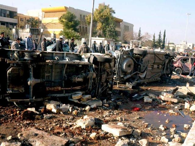 In-this-photo-released-by-the-Syrian-official-news-agency-SANA-Syrian-people-gather-at-the-site-after-an-explosion-hit-a-university-in-Aleppo-Syria-AP-Photo In-this-photo-released-by-the-Syrian-official-news-agency-SANA-Syrian-people-gather-at-the-site-after-an-explosion-hit-a-university-in-Aleppo-Syria-AP-Photo