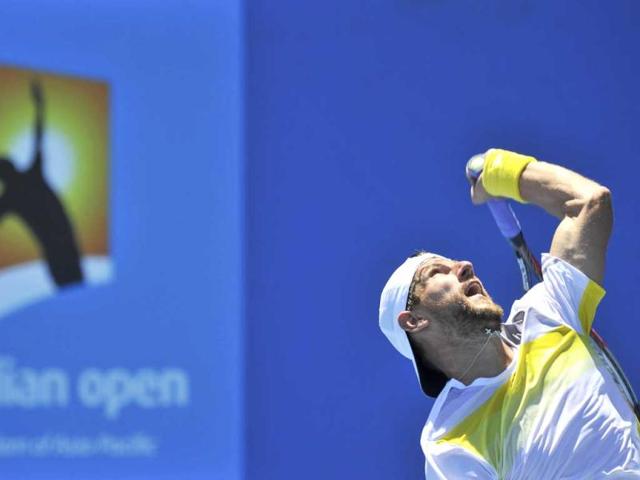 Jurgen Melzer of Austria serves to Roberto Bautista Agut of Spain during their men's singles match at the Australian Open tennis tournament in Melbourne. Reuters