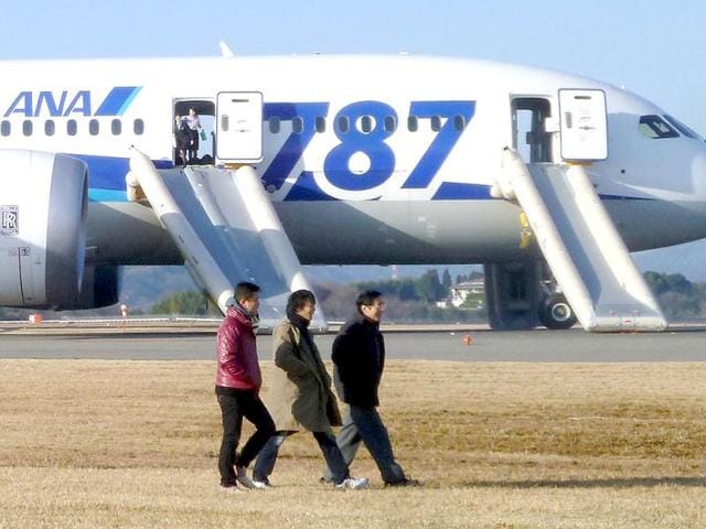 Passengers walk away from All Nippon Airways' (ANA) Boeing Co's 787 Dreamliner plane which made an emergency landing at Takamatsu airport, western Japan, as seen in this photo taken by a passenger. (Reuters)