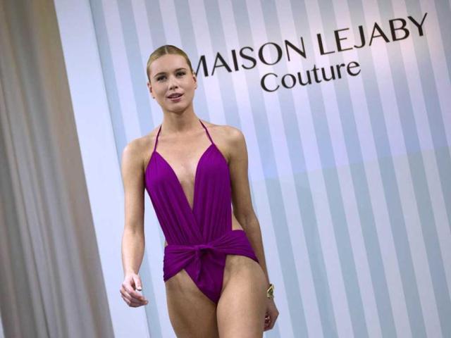 A dancer from the French cabaret Le 'Lido' displays a creation designed by French lingerie company Lejaby, during the women's Fall-Winter 2013-2014 collection show in Paris. (AFP Photo)