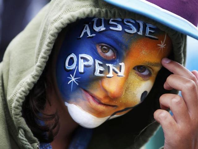 A fan with a painted face attends the Australian Open tennis tournament in Melbourne. Reuters