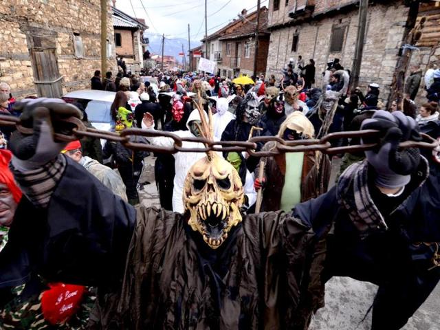 Masked villagers parade during the carnival in Macedonia's southwestern village of Vevcani. AP Photo
