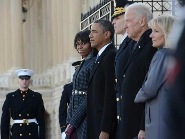 US President Barack Obama (2L) and First Lady Michelle Obama (L), Vice President Joe Biden (2R) and Jill Biden (R) along with Maj. Gen. Michael S. Linnington (C), participate in the review of the troops following the presidential inaugural swearing-in ceremony in Washington, DC. AFP photo