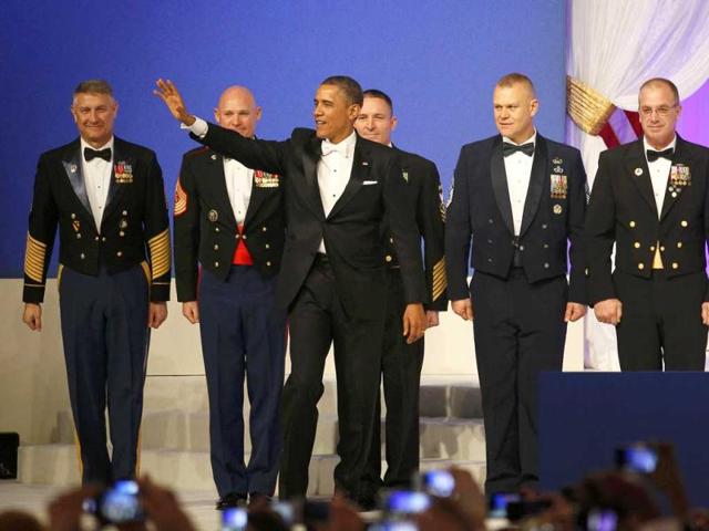 US President Barack Obama stands with members of the US military at the Commander in Chief's Ball during presidential inauguration ceremonies in Washington. Reuters photo