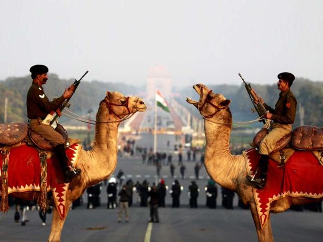 Border Security Force (BSF) soldiers ride their camels in front of Rashtrapati Bhavan during a rehearsal for the "Beating the Retreat" ceremony at Raisina Hills in New Delhi. HT/Sonu Mehta