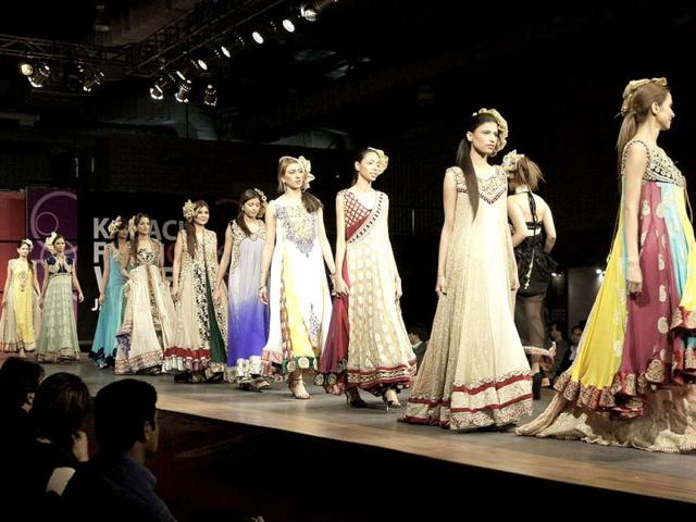 Pakistani models present creations by designer Zeeshan Bariwala on the opening day of Karachi Fashion Week, in Karachi. AP Photo