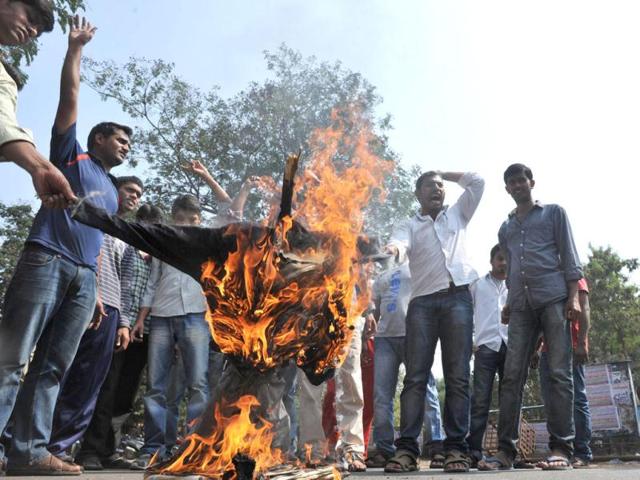 Telangana Joint Action Committee (TJAC) activists burn and effigy representing the UPA government during a protest demanding the separate state of Telangana in Hyderabad. AFP Photo