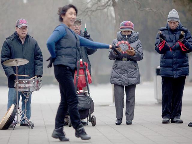 Elderly people play music together in Jinshan park in Beijing. China's demographic timebomb is ticking significantly louder with the first fall in its labour pool for decades, analysts say, highlighting the risk that the country grows old before it grows rich. AFP PHOTO