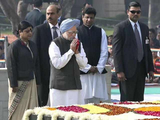 Prime Minister Manmohan Singh offers tributes at the memorial of Mahatma Gandhi on his death anniversary in New Delhi. Gandhi was assassinated on this day in 1948. (AP Photo/Manish Swarup)