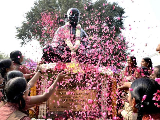 Students paying floral tributes to Mahatma Gandhi on his 65th death anniversary at Bapu Ghat in Hyderabad. PTI Photo