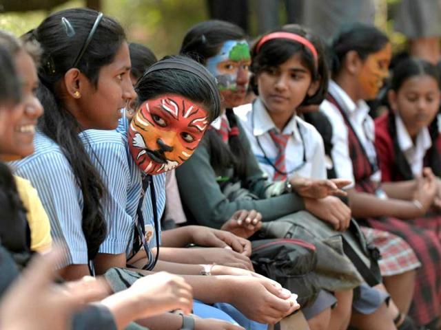 School children with their faces painted take part in the "Save Tiger Campaign" in Bangalore. AFP