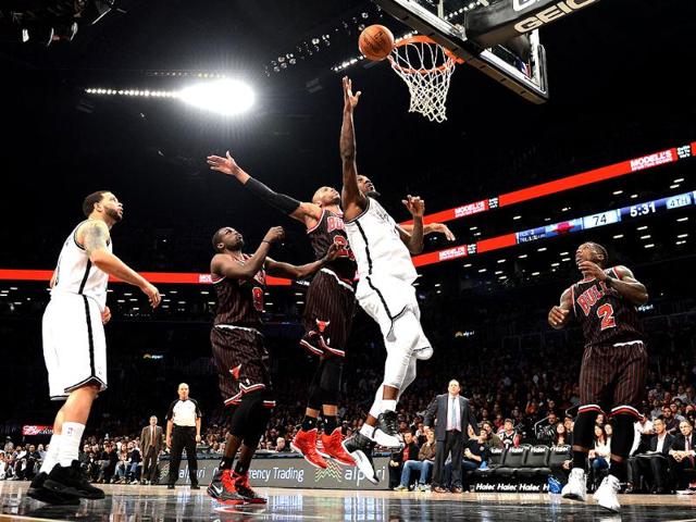Andray Blatche of the Brooklyn Nets drives against Taj Gibson of the Chicago Bulls during game at the Barclay Center in the Brooklyn borough of New York. AFP/Stan Honda