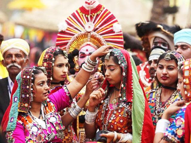 Artists get ready to perform on the 'chaupal' at the inauguration of the Surajkund International Crafts Mela at Surajkund, Haryana. PTI