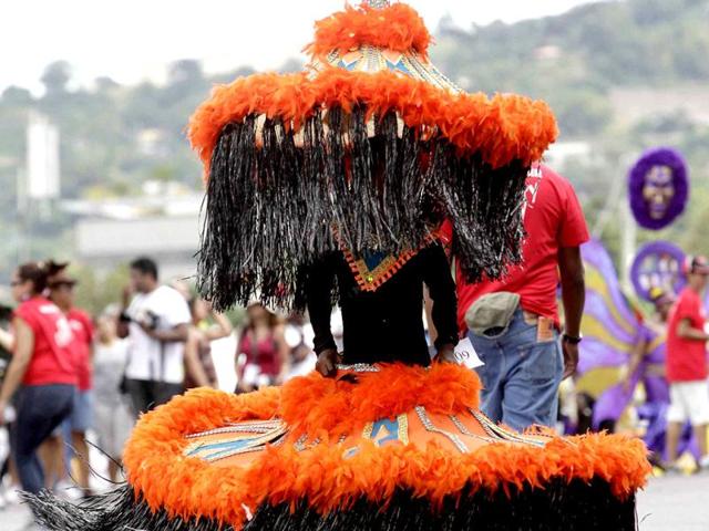 A participant takes part in a masquerade parade at the Trinidad and Tobago Red Cross Society's Children Carnival at Queen's Park Savannah, Port of Spain. REUTERS/Andrea de Silva