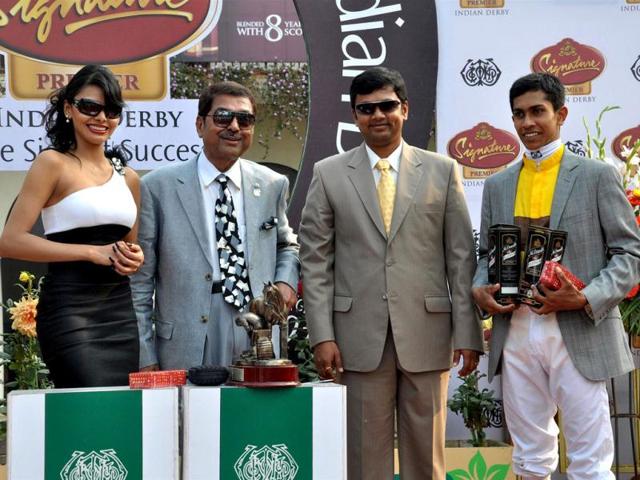 Sherlyn Chopra looks glamorous as she hands over the The McDowell No 1 Platinum Trophy to the winning jockey and the trainer at Indian Derby in Mumbai. She said, "I am very happy to be here, I would like to thank Dr. Mallya for inviting me to be in the company of sexy horses and hot jockeys".