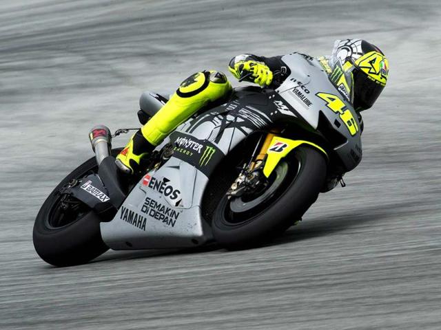 Yamaha MotoGP rider Valentino Rossi of Italy powers his bike on the first day of the pre-season motorcyling test at the Sepang circuit outside Kuala Lumpur. AFP/Saeed Khan