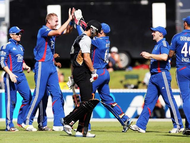 England's Stuart Broad celebrates his hat trick with the wicket of New Zealand's Matthew Henry during the warm up Twenty20 cricket match between the New Zealand XI and England at Cobham Oval in Whangarei. AFP/Michael Bradley